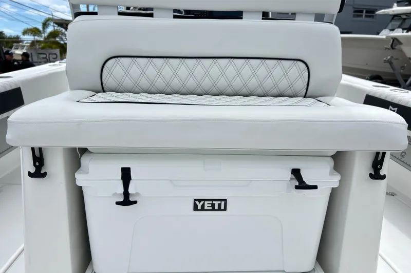 Slide: The Image of White cushioned seat with Yeti cooler on 2026 Sea Fox 282 Hybrid LT boat. - 12