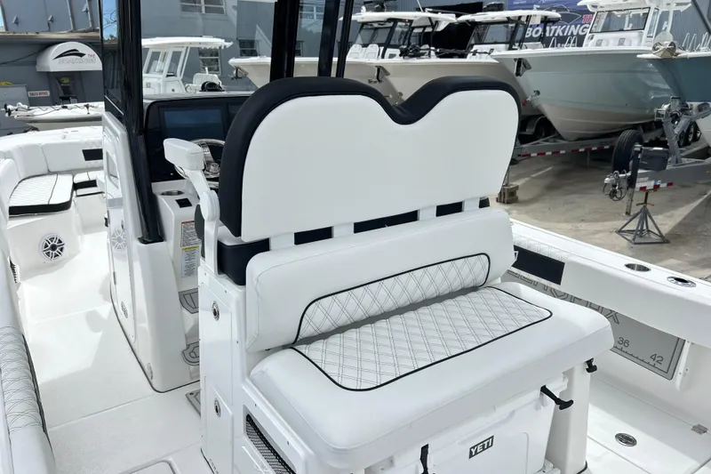 Slide: The Image of 2026 Sea Fox 282 Hybrid LT boat interior with white seating and modern design. - 15