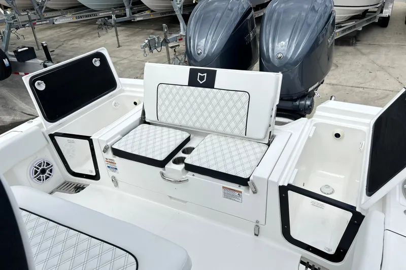 Slide: The Image of 2026 Sea Fox 282 Hybrid LT boat interior with dual engines and cushioned seating. - 18