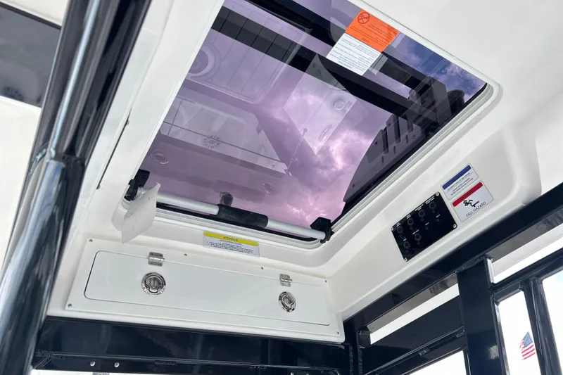 Slide: The Image of Interior view of 2026 Sea Fox 282 Hybrid LT boat with skylight and control panel. - 25