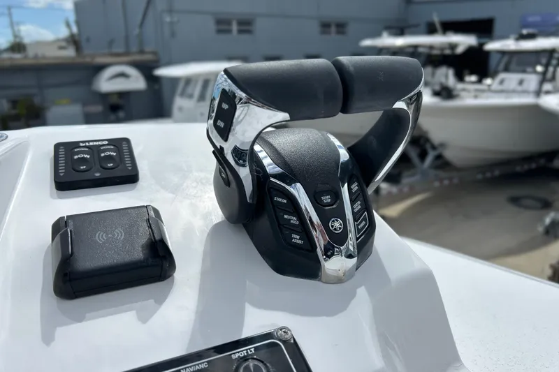 Slide: The Image of Control panel of 2026 Sea Fox 282 Hybrid LT boat with throttle and buttons. - 27