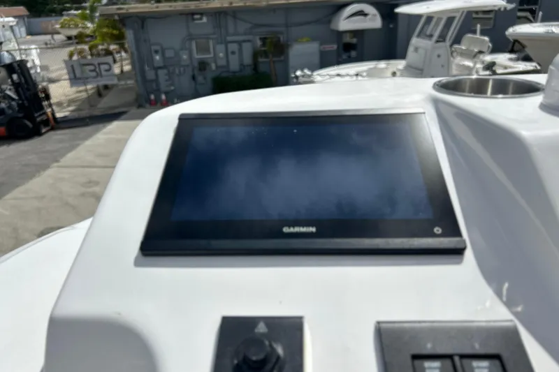 Slide: The Image of Garmin display on 2026 Sea Fox 282 Hybrid LT boat dashboard in marina setting. - 28