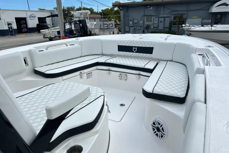 Slide: The Image of 2026 Sea Fox 282 Hybrid LT boat interior with white cushioned seating and modern design. - 3