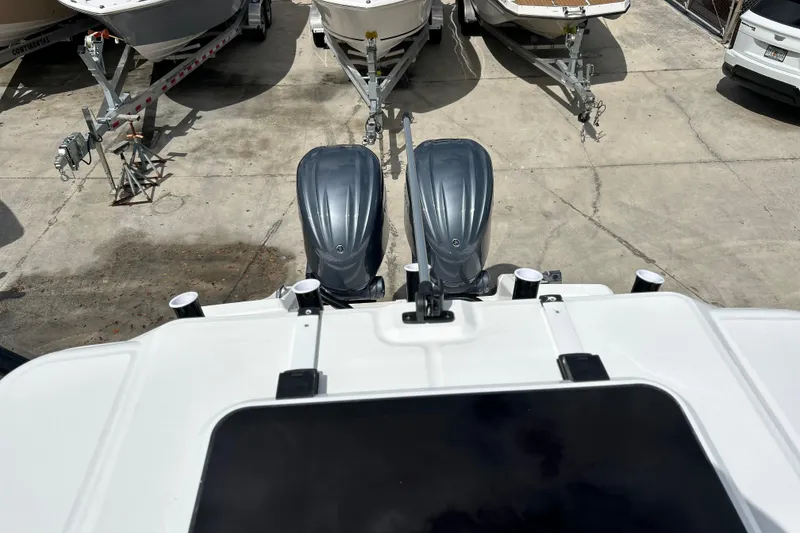 Slide: The Image of Overhead view of 2026 Sea Fox 282 Hybrid LT boat engines in a parking area. - 30