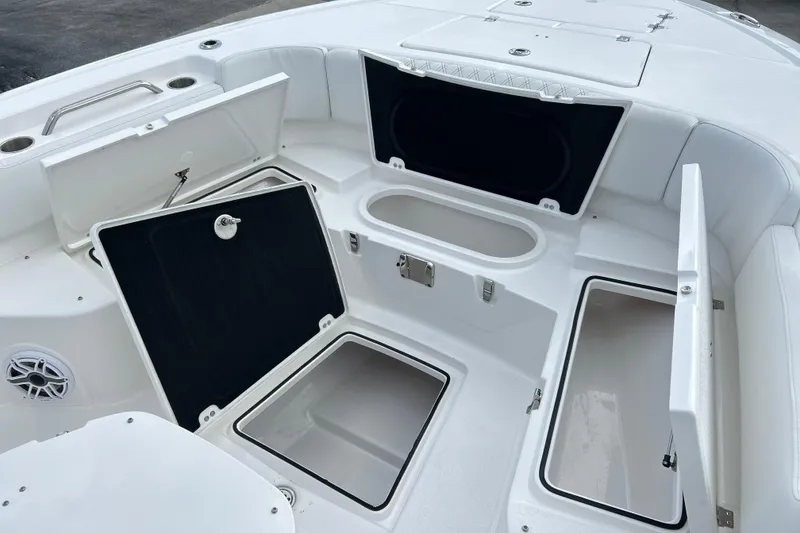 Slide: The Image of 2026 Sea Fox 282 Hybrid LT boat with open storage compartments and seating area. - 35