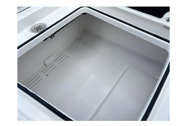 Slide: The Image of Storage compartment of 2026 Sea Fox 282 Hybrid LT boat, featuring a drain. - 36