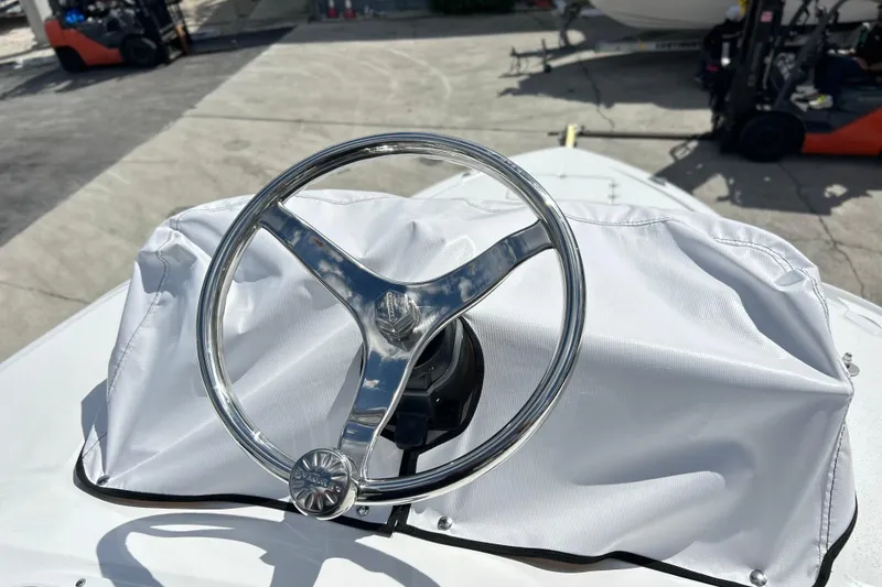 Slide: The Image of Steering wheel of 2026 Sea Fox 282 Hybrid LT boat, covered in white fabric. - 40
