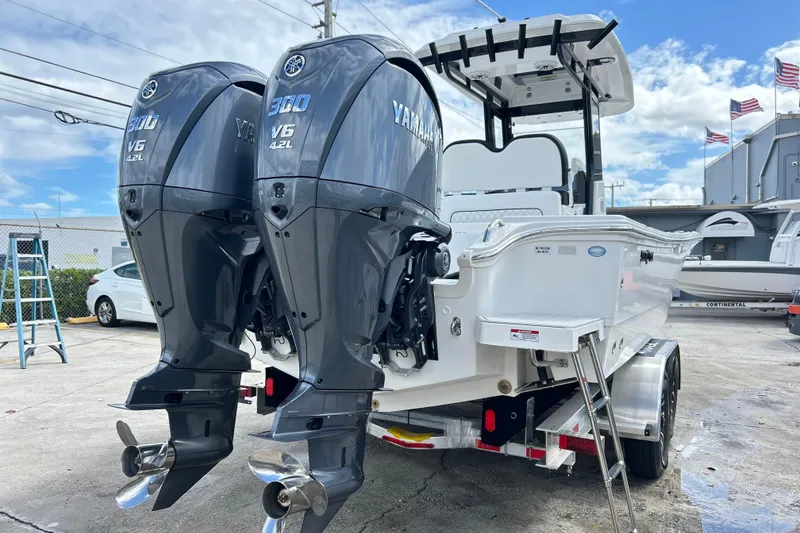 Slide: The Image of 2026 Sea Fox 282 Hybrid LT boat with dual Yamaha V6 engines on trailer. - 44