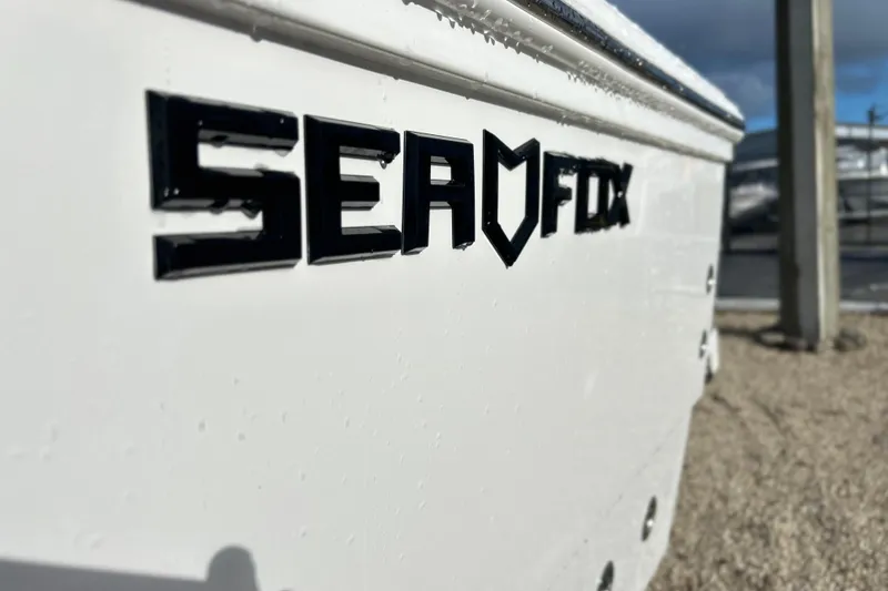 Slide: The Image of Close-up of 2026 Sea Fox 282 Hybrid LT boat logo on white hull. - 46
