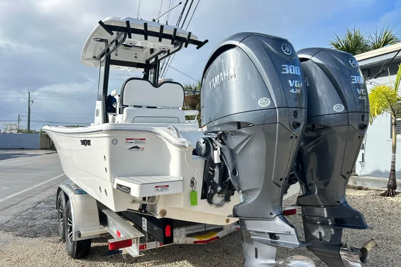 Slide: The Image of 2026 Sea Fox 282 Hybrid LT boat with dual Yamaha 300 engines on trailer. - 47