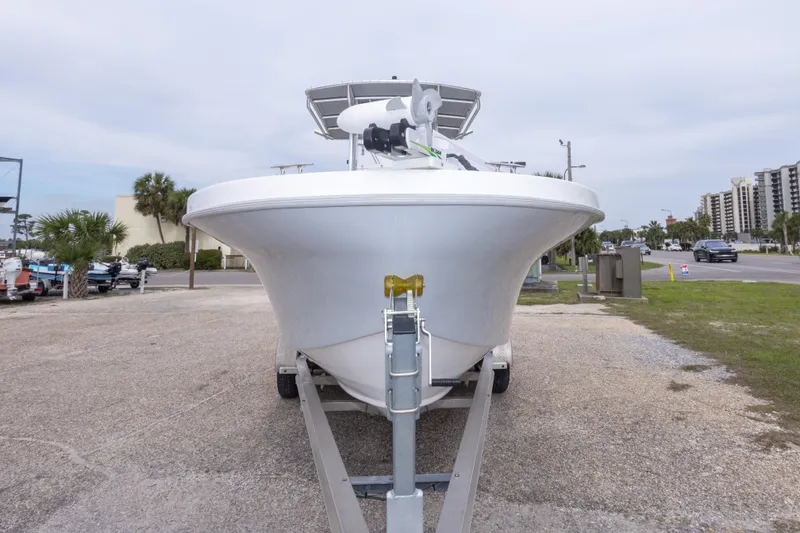 Slide: The Image of 2023 Dusky 252 Open Fisherman boat on trailer, parked outdoors. - 10