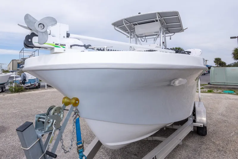 Slide: The Image of 2023 Dusky 252 Open Fisherman boat on trailer, front view. - 11