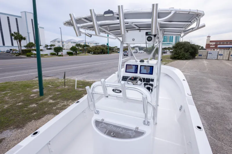 Slide: The Image of 2023 Dusky 252 Open Fisherman boat with modern console and navigation equipment. - 14