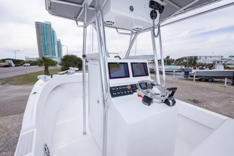 Slide: The Image of 2023 Dusky 252 Open Fisherman boat with modern console and dual screens. - 16