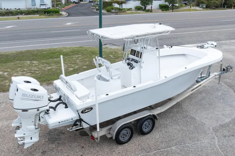 Slide: The Image of 2023 Dusky 252 Open Fisherman boat on trailer with dual Suzuki engines. - 34