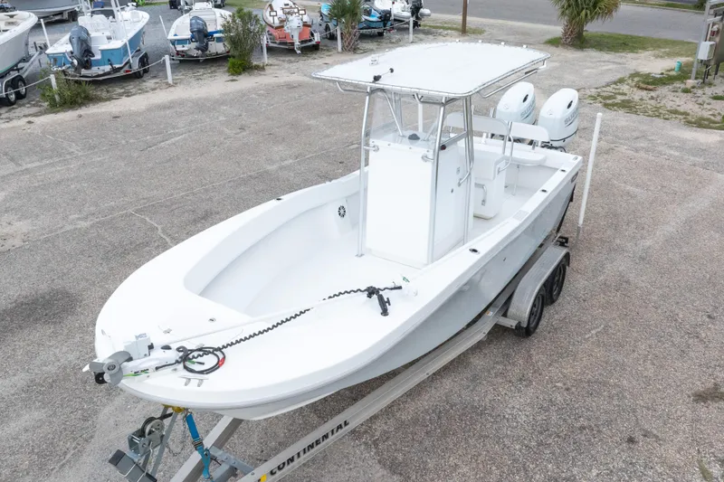 Slide: The Image of 2023 Dusky 252 Open Fisherman boat on trailer in parking lot. - 38
