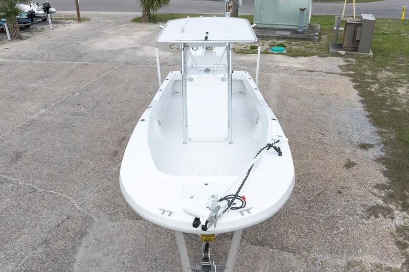 Slide: The Image of 2023 Dusky 252 Open Fisherman boat on a concrete surface, viewed from above. - 39
