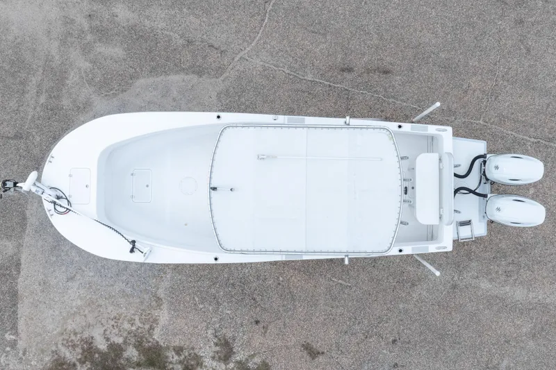 Slide: The Image of Aerial view of 2023 Dusky 252 Open Fisherman boat on concrete surface. - 40