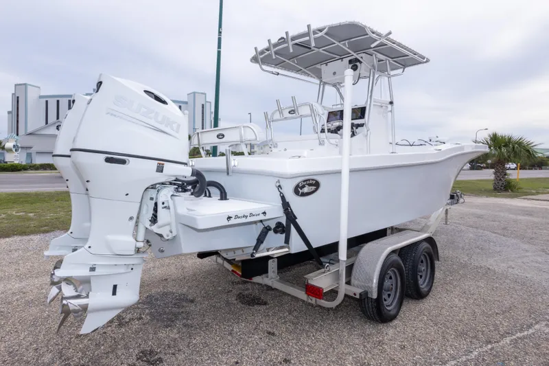 Slide: The Image of 2023 Dusky 252 Open Fisherman boat on trailer with Suzuki outboard motor. - 5