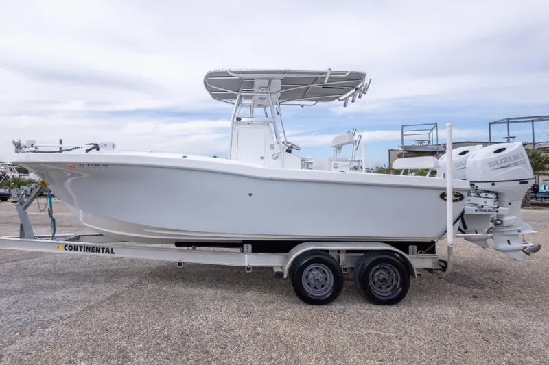 Slide: The Image of 2023 Dusky 252 Open Fisherman boat on trailer with Suzuki outboard motor. - 8