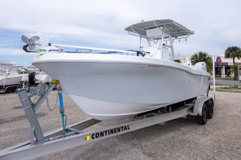 Slide: The Image of 2023 Dusky 252 Open Fisherman boat on trailer in outdoor setting. - 9
