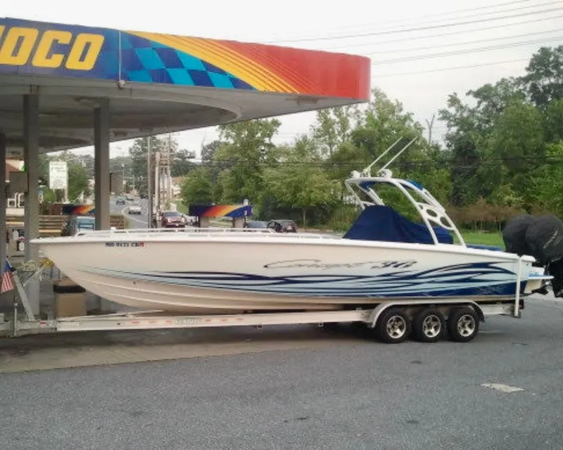 The Image of 2007 Concept 36 boat parked at a gas station. - 0