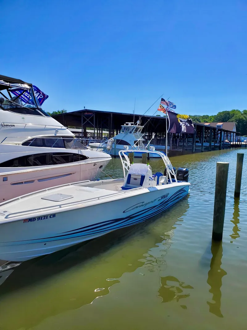 Slide: The Image of 2007 Concept 36 boat docked in marina under sunny skies. - 2