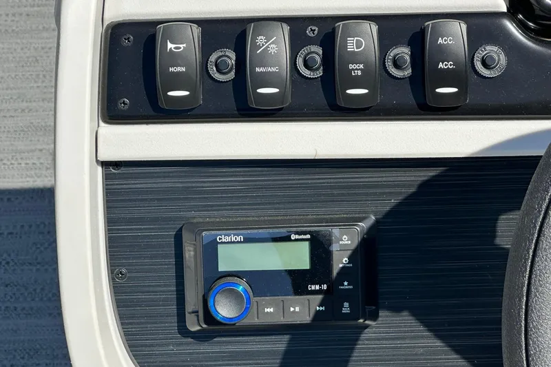 Slide: The Image of Control panel of Sweetwater SW2086CPSE 2026 with switches and Clarion Bluetooth device. - 14