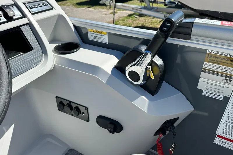 Slide: The Image of Control panel of a 2026 Sweetwater SW2086CPSE boat with throttle and capacity label. - 19