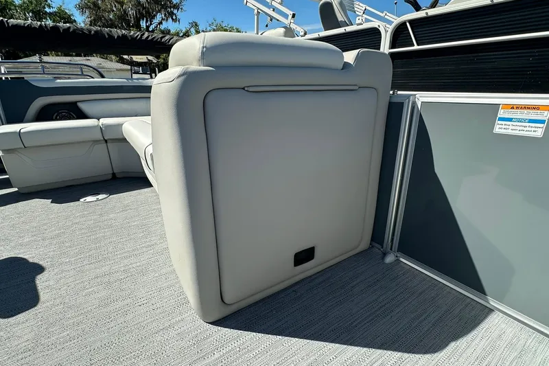 Slide: The Image of 2026 Sweetwater SW2086CPSE boat interior with gray seating and flooring. - 22