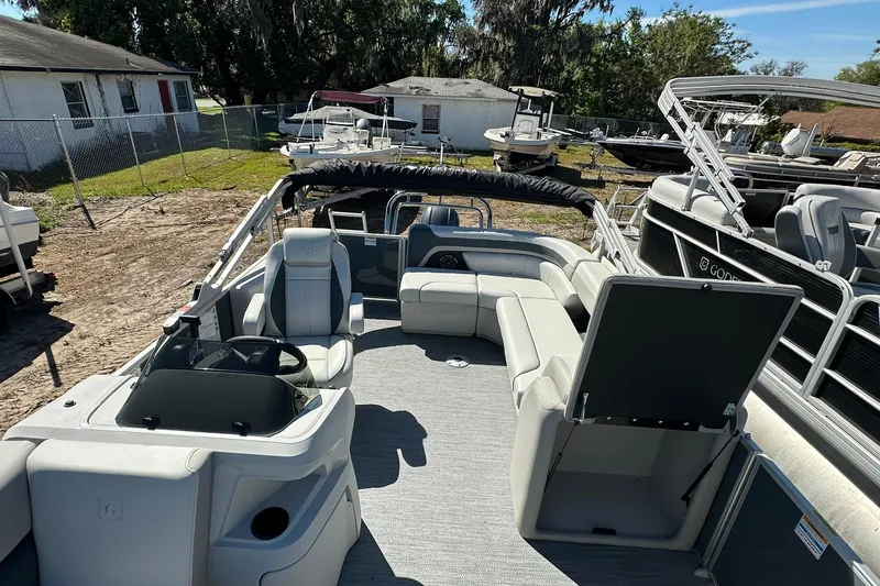 Slide: The Image of 2026 Sweetwater SW2086CPSE pontoon boat with spacious seating and modern design. - 23