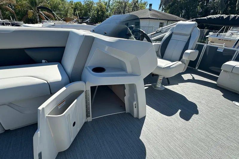 Slide: The Image of 2026 Sweetwater SW2086CPSE boat interior with seating, storage, and steering console. - 25