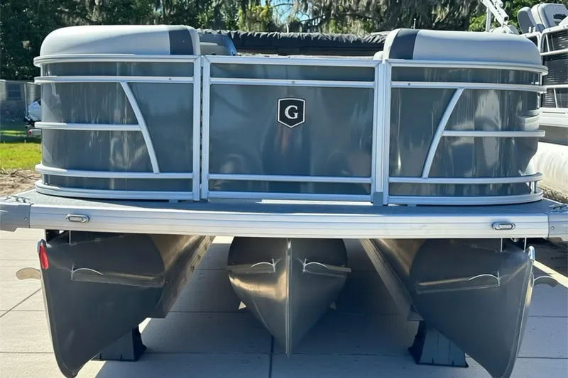 Slide: The Image of 2026 Sweetwater SW2086CPSE pontoon boat, front view, docked on a sunny day. - 3