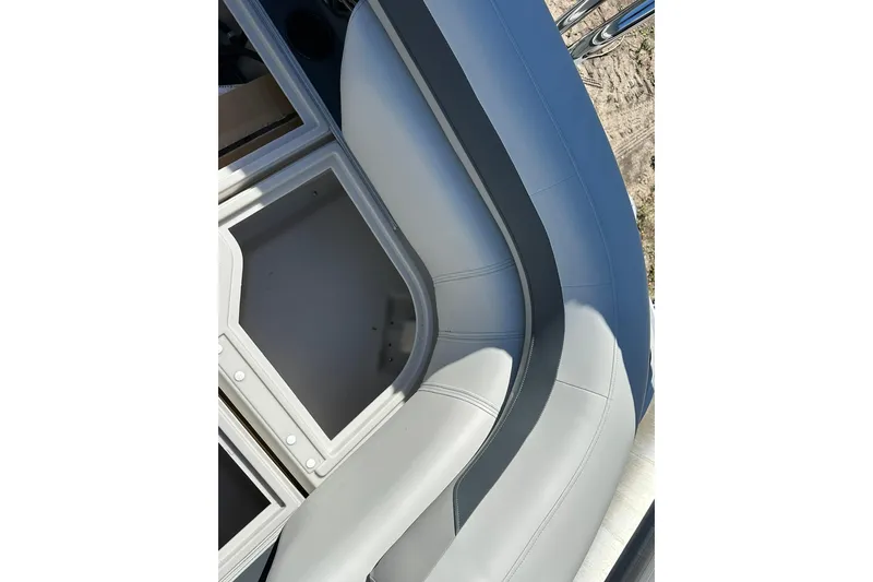 Slide: The Image of 2026 Sweetwater SW2086CPSE boat interior with sleek gray seating and storage compartments. - 37