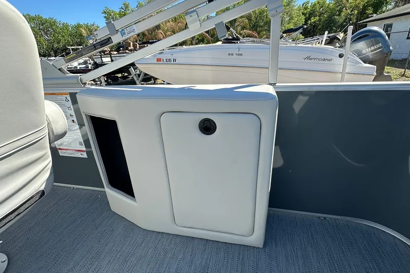 Slide: The Image of 2026 Sweetwater SW2086CPSE boat interior with storage compartment and seating. - 39