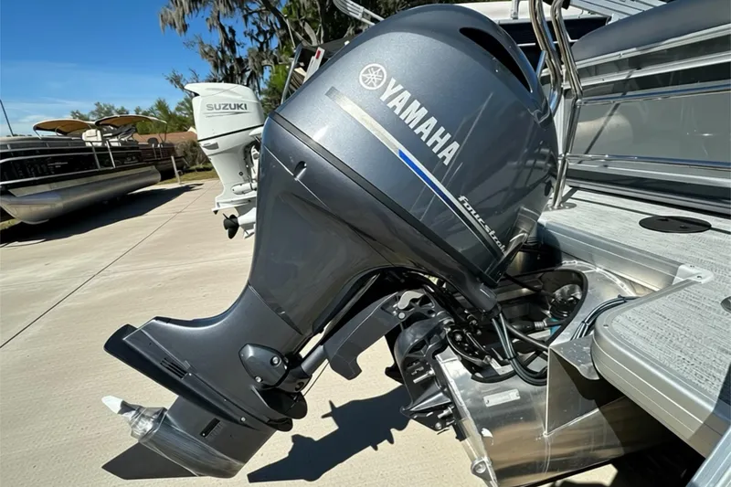 Slide: The Image of Outboard motor on a Sweetwater SW2086CPSE boat, 2026 model, in a sunny marina. - 45