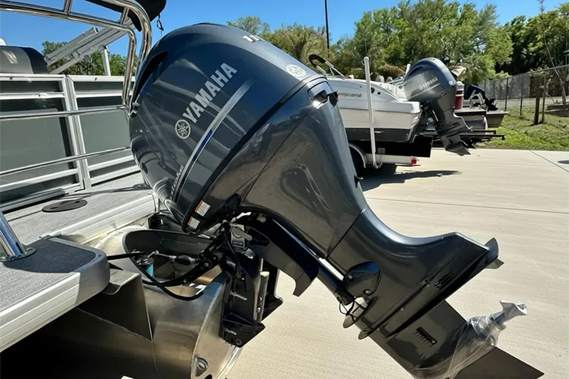 Slide: The Image of 2026 Sweetwater SW2086CPSE boat with Yamaha outboard motor in a sunny outdoor setting. - 46