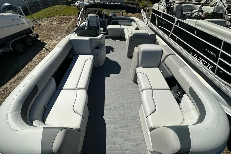 Slide: The Image of Luxurious 2026 Sweetwater SW2086CPSE pontoon boat with spacious seating and modern design. - 5