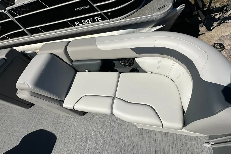 Slide: The Image of Luxurious seating on 2026 Sweetwater SW2086CPSE pontoon boat, featuring sleek gray upholstery. - 6