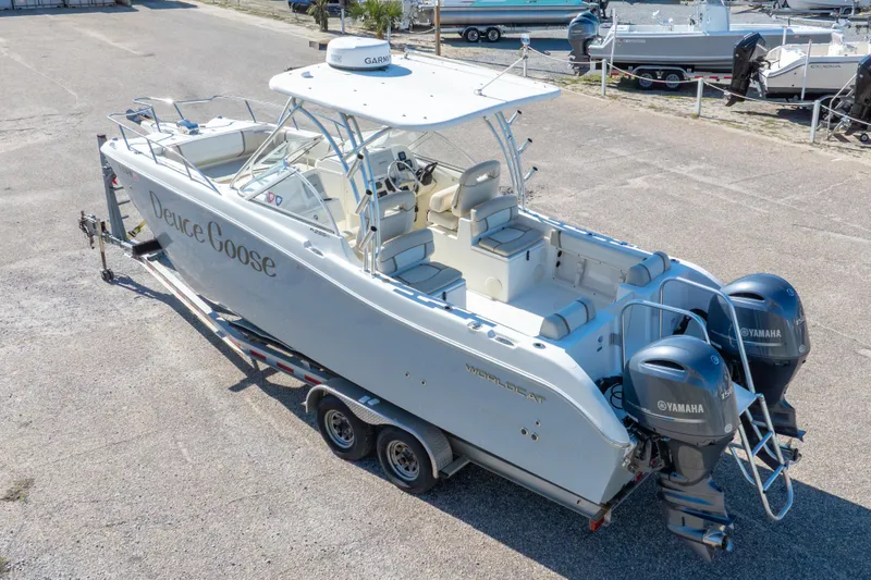 Slide: The Image of 2016 World Cat 255 DC boat with twin Yamaha engines on a trailer. - 12