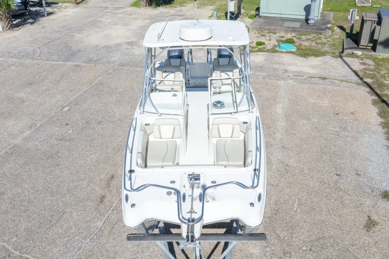 Slide: The Image of 2016 World Cat 255 DC boat, aerial view, showcasing spacious seating and sleek design. - 15