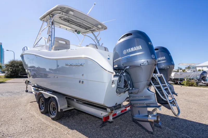 Slide: The Image of 2016 World Cat 255 DC boat with twin Yamaha engines on a trailer. - 18