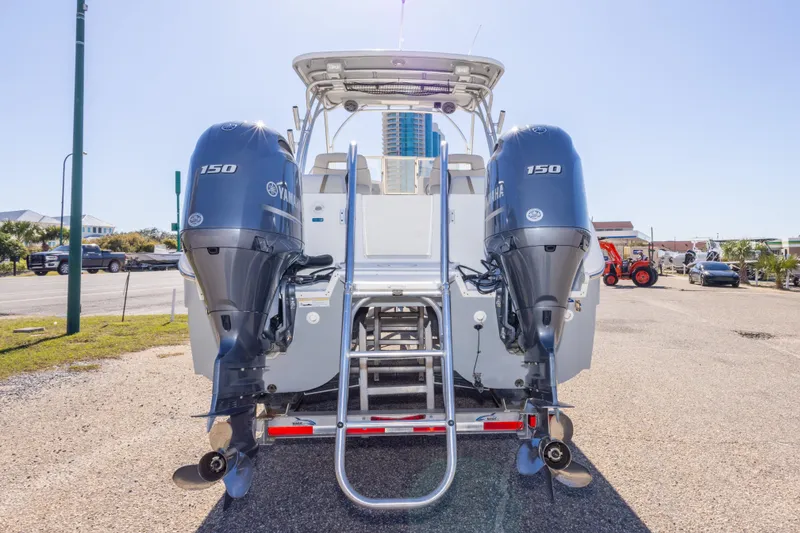 Slide: The Image of 2016 World Cat 255 DC boat with dual Yamaha 150 engines, rear view. - 19