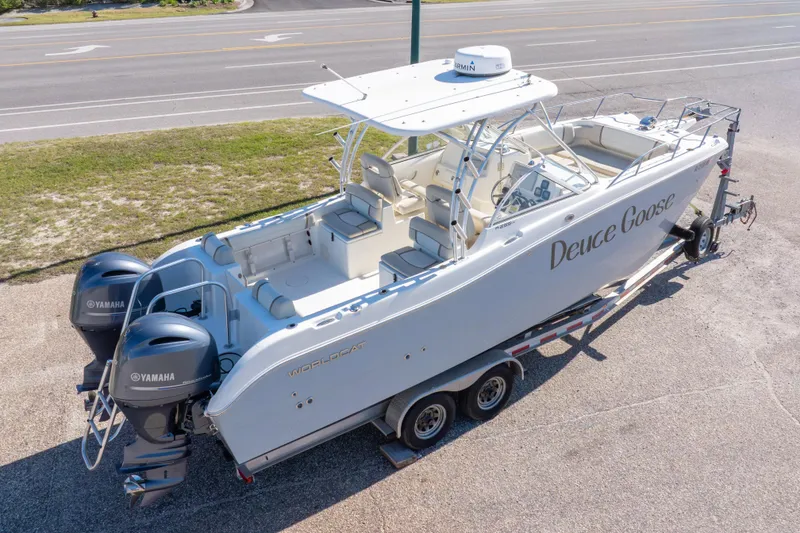 Slide: The Image of 2016 World Cat 255 DC boat on trailer with twin Yamaha engines. - 2