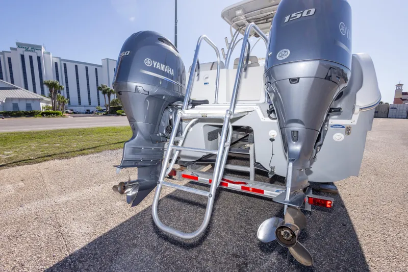 Slide: The Image of 2016 World Cat 255 DC boat with dual Yamaha 150 engines and ladder. - 20