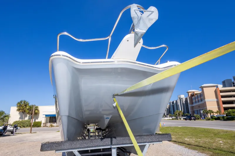 Slide: The Image of 2016 World Cat 255 DC boat on trailer under clear blue sky. - 22