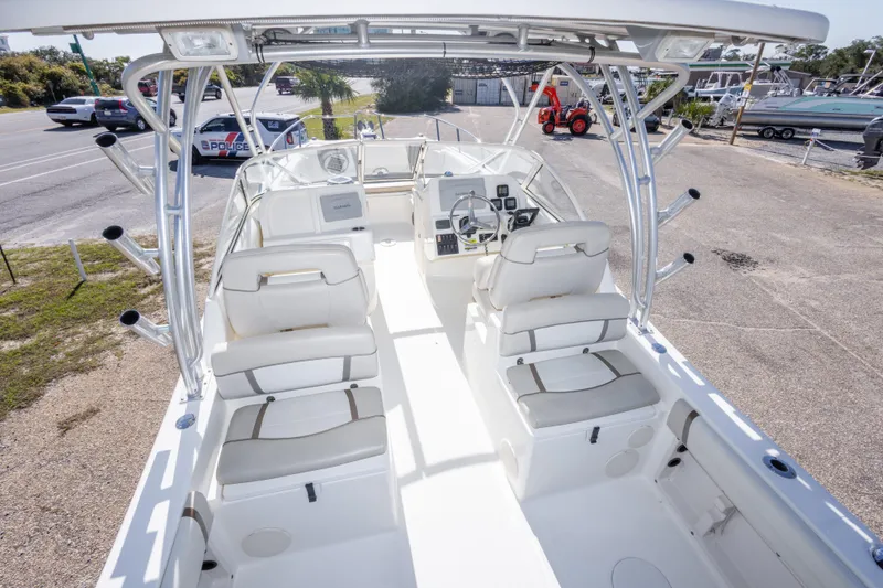 Slide: The Image of 2016 World Cat 255 DC boat interior with seating and steering console. - 24
