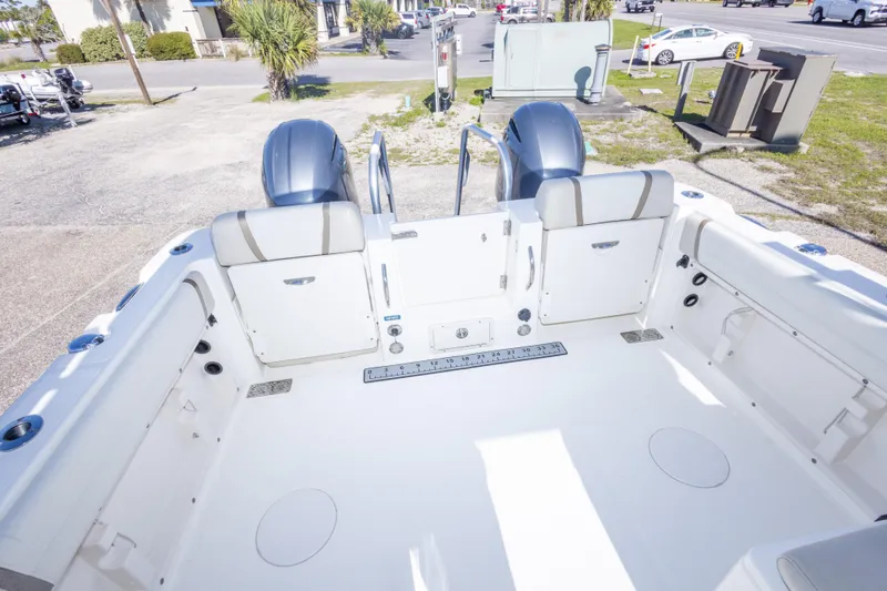 Slide: The Image of 2016 World Cat 255 DC boat interior with dual engines and spacious seating. - 38