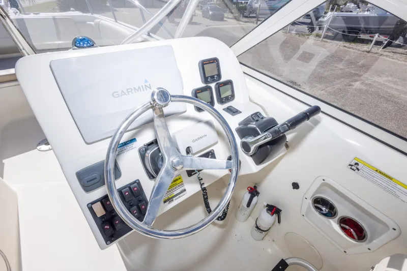 Slide: The Image of 2016 World Cat 255 DC boat helm with Garmin navigation system and controls. - 39