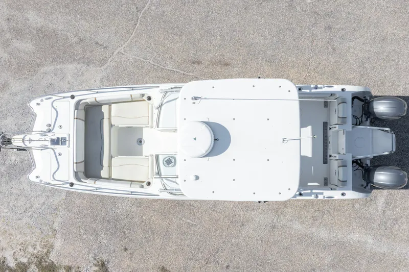 Slide: The Image of Overhead view of a 2016 World Cat 255 DC boat on a concrete surface. - 9